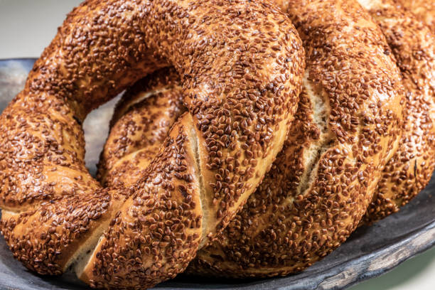 close up ready to eat turkish bagel named simit with sesame close up ready to eat turkish bagel named simit with sesame biscuit quick bread stock pictures, royalty-free photos & images