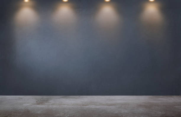 istock Dark gray wall with a row of spotlights in an empty room 1093917716