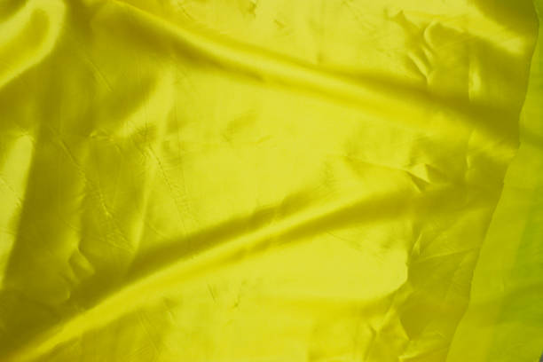 istock Smooth elegant golden silk can use as background . 1093921724