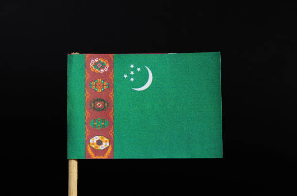 The national flag of Turkmenistan on toothpick on black background. A green field with a vertical red stripe near the hoist side The national flag of Turkmenistan on toothpick on black background. A green field with a vertical red stripe near the hoist side. khuzestan province stock pictures, royalty-free photos & images
