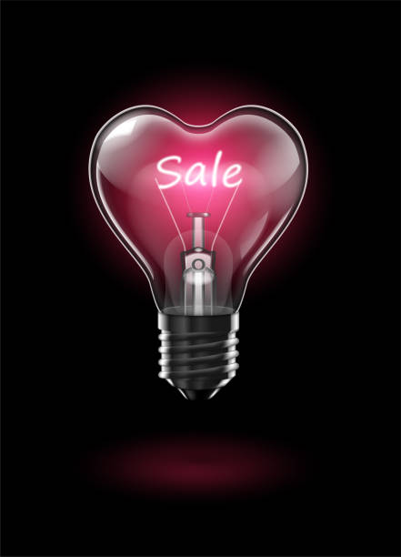 istock Transparent glowing heart-shaped light bulb on a dark background with the word Sale instead of a tungsten filament. Highly realistic illustration. 1093925498