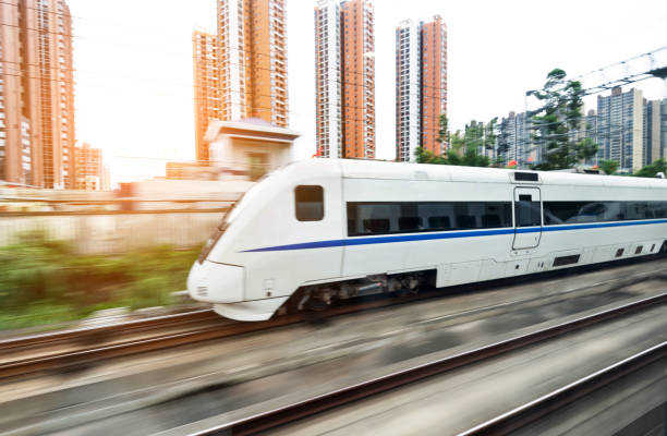 istock High speed train driving in the city 1093925744