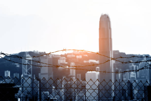 istock Cityscape outside barbed wire fence 1093925836
