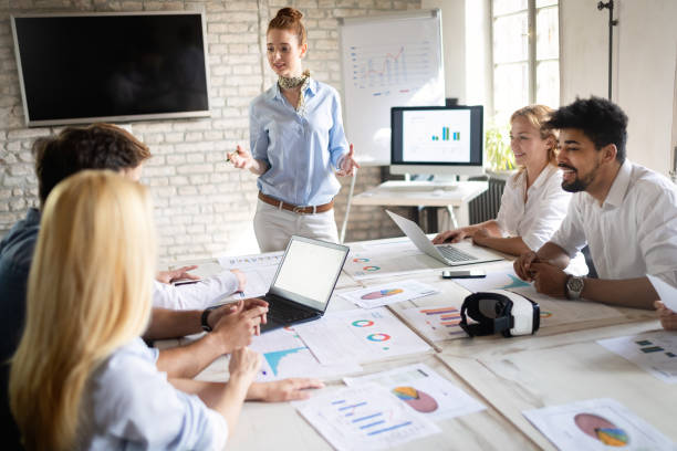 istock Business, technology and people concept - creative team or designers working in office 1093925874