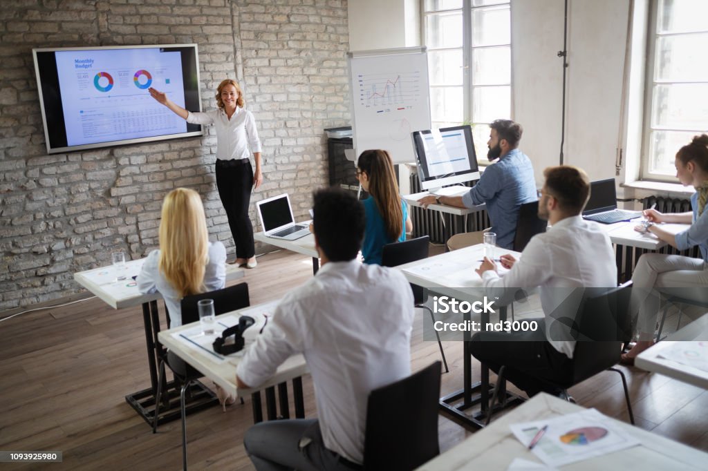 Successful happy group of people learning software engineering and business during presentation Successful happy group of students learning software engineering and business during presentation Education Stock Photo