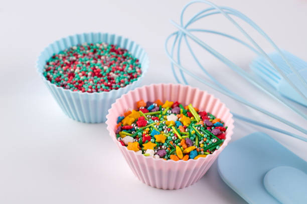 istock Set of kitchenware for cooking pastries and  Rainbow sprinkles for decoration on white background 1093926148