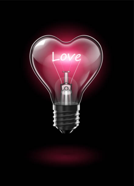 istock Transparent glowing heart-shaped light bulb on a dark background with the word Love instead of a tungsten filament. Highly realistic illustration. 1093928742
