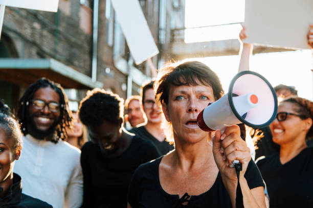 istock Feminist with a megaphone at a protest 1093932478