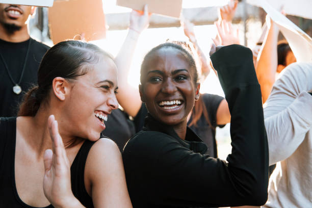 istock Happy activists marching through the city 1093932798