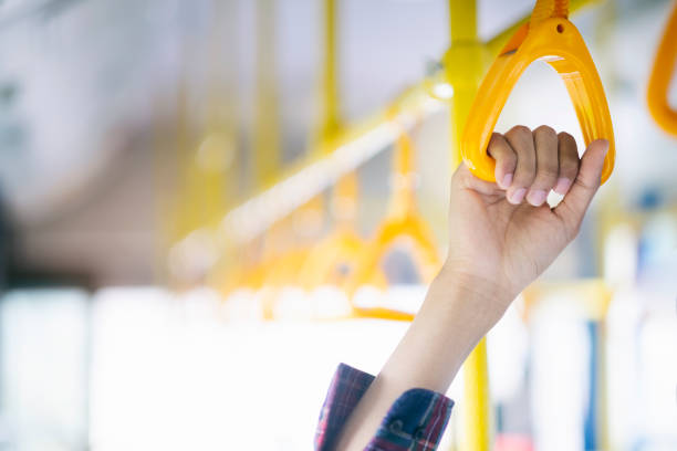 istock Closeup passenger  hand holding handle on the public transportation. 1093934364