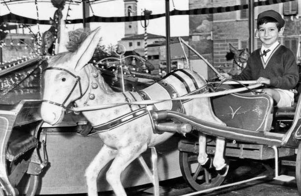 istock Young boy on a carousel in 1963 1093934434
