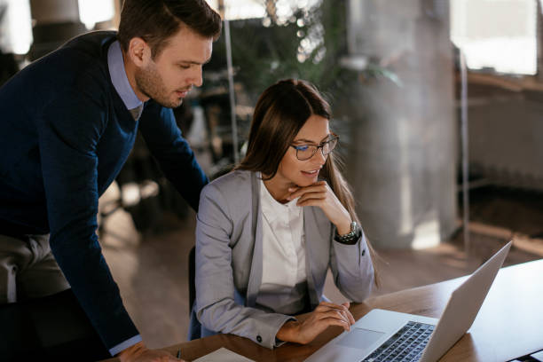 istock Young colleagues sitting together and working in the office 1093934664