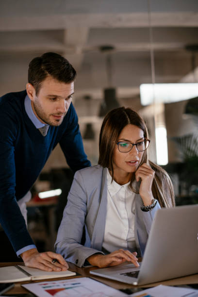 istock Young colleagues sitting together and working in the office 1093934826
