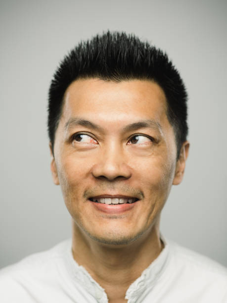 istock Real chinese man with excited expression looking to the side 1093937546