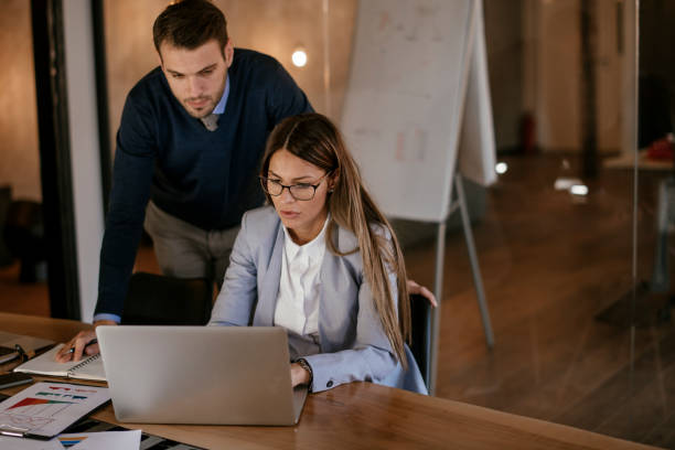 istock Young colleagues sitting together and working in the office 1093938894