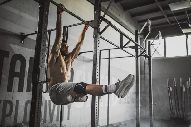 istock Young muscular build athlete exercising strength in a gym. 1093939052