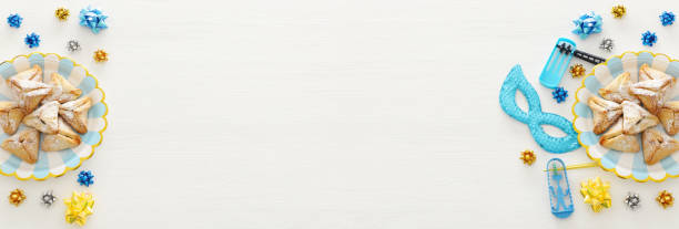istock Purim celebration concept (jewish carnival holiday) over wooden white background. 1093940662