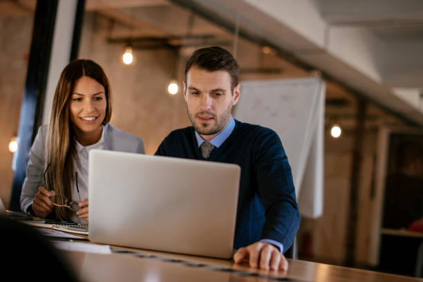 istock Young colleagues sitting together and working in the office 1093941290