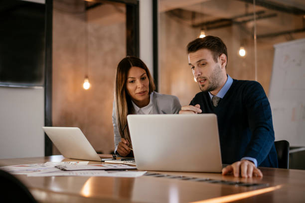 istock Young colleagues sitting together and working in the office 1093941536