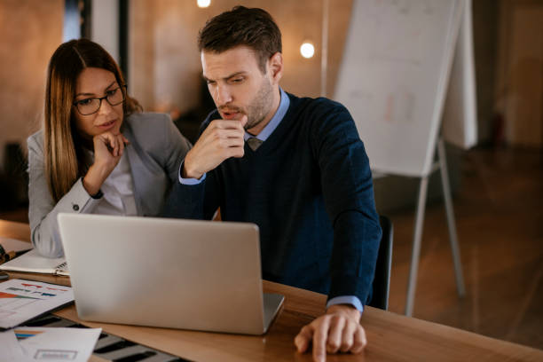 istock Young colleagues sitting together and working in the office 1093941788