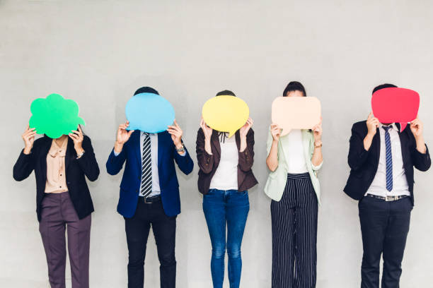 istock Group of business holding a speech bubble icon 1093944744