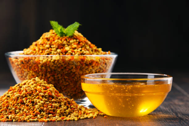 istock Bowls with bee pollen and honey on kitchen table 1093944786