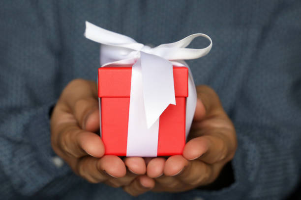 istock Gift box in male hands close up 1093944788