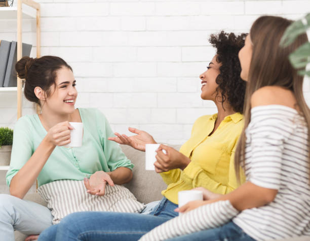 istock Friends enjoying conversation and drinking coffee at home 1093950678