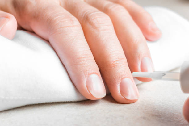 istock Woman hand with natural nails preparing manicure 1093955530