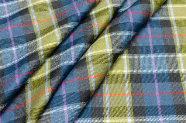 istock Fabric woolen, costume cell gray-black-red-yellow-turquoise 1093961530