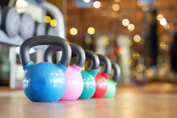 istock Colorful kettlebells in gym 1093964412