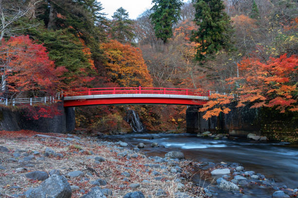 istock Red bridge and Fudo stream at Mount Nakano 1093964482