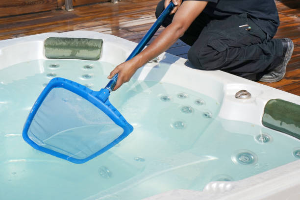 istock Hotel staff worker cleaning the pool. Maintenance. 1093964530