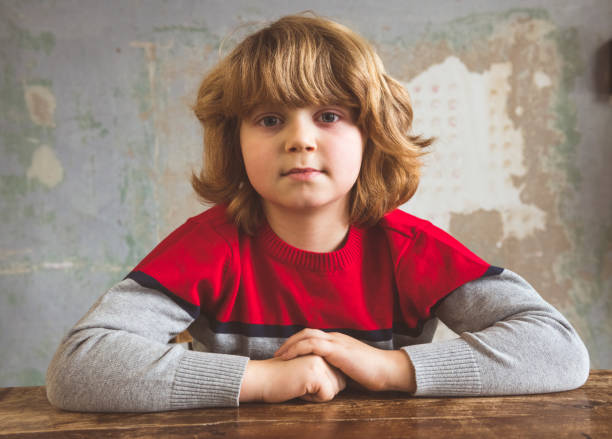 istock Cute little boy at the desk 1093968124