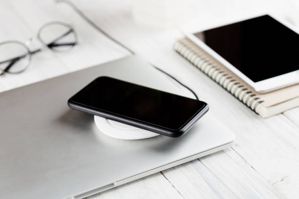 istock phone charging on wireless charger new technology 1093969238