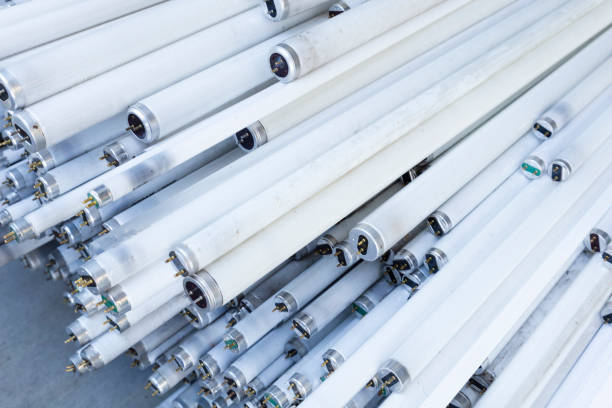 Stack of disused neon lamp tubes stock photo