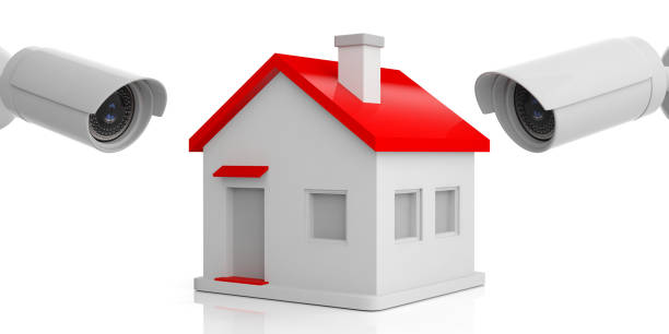 istock Security Camera CCTV watching a small house on white background. 3d illustration 1093972308