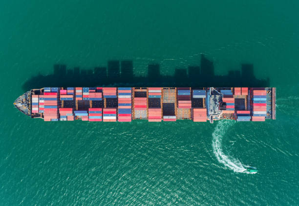 istock Aerial top view container ship at sea port for logistics import export, shipping or transportation. 1093972664