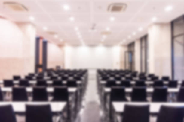 istock Blurred background of conference hall or seminar room. 1093972878