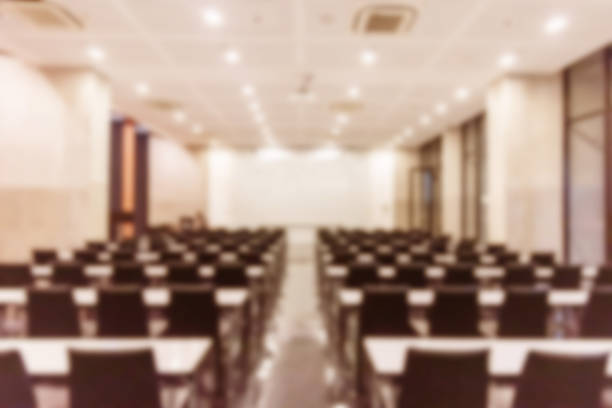 istock Blurred background of conference hall or seminar room. 1093972892