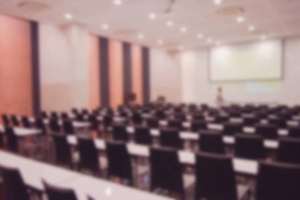 istock Blurred background of conference hall or seminar room. 1093972956