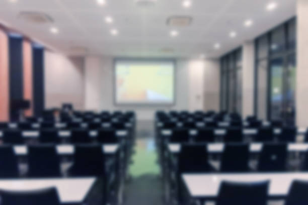 istock Blurred background of conference hall or seminar room. 1093973360