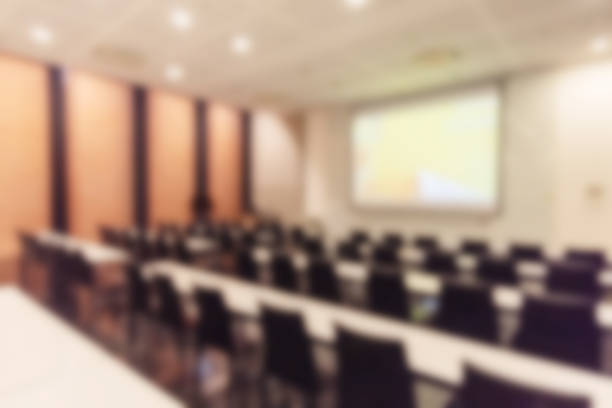 istock Blurred background of conference hall or seminar room. 1093974140