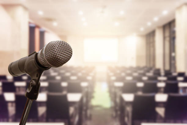 istock Microphone over the blurred business forum Meeting or Conference Training Learning Coaching Room Concept, Blurred background. 1093974182