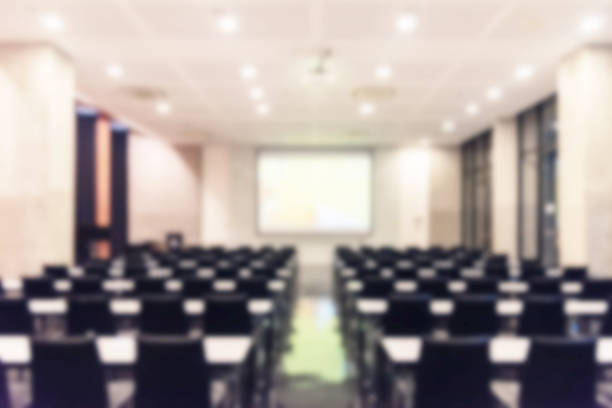 istock Blurred background of conference hall or seminar room. 1093974212