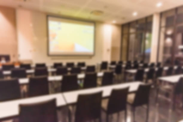 istock Blurred background of conference hall or seminar room. 1093974274