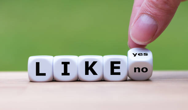 istock To like something? Hand turns a dice and changes the word 