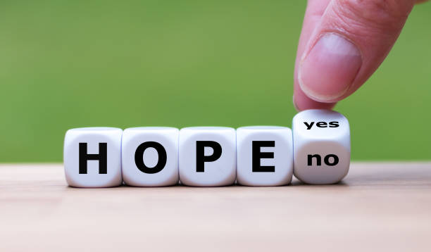 istock Having hope? Hand turns a dice and changes the word 