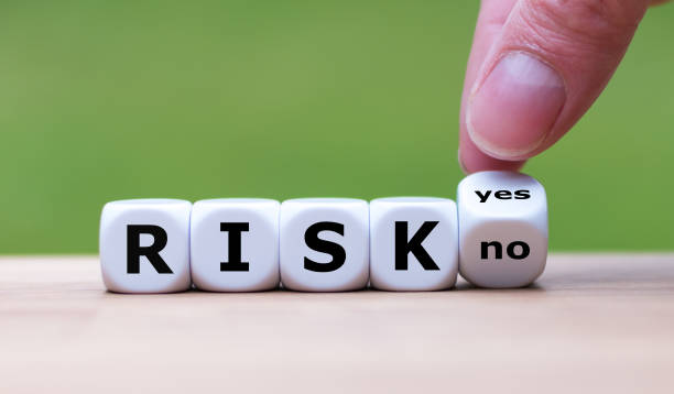 istock Take a risk? Hand turns dice and changes the word 