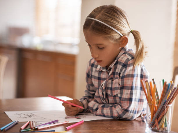 istock Busy with her own little masterpiece 1093976420